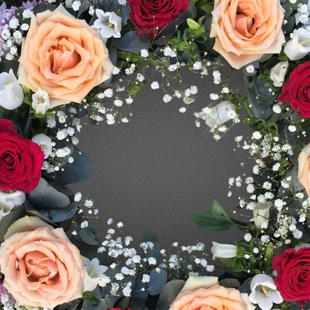 Close-up detail of the artisan craftsmanship of the FLOWER SHED Brisbane wreath, showcasing the realistic textures and bright colours of the faux rose, chrysanthemum, and lisianthus flowers.
